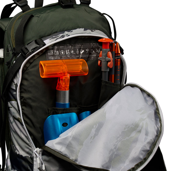 The North Face Snomad 23 Backpack Rocko Green Multi Camo Print/Rosin Green